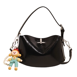 Glossy black patent leather half-moon bag with silver lock and cartoon clown pendant