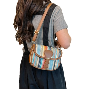 Striped woven straw crossbody bag for women with colorful patterns and leather trim
