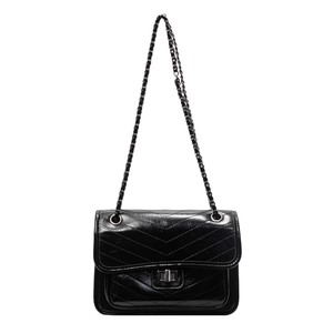 Classic black chevron quilted shoulder bag with silver chain strap and metal lock