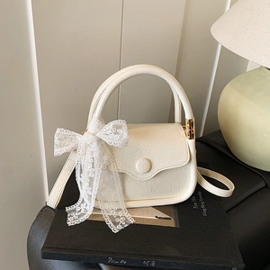 Elegant cream saddle bag with lace bow decoration and vintage pleated PU leather finish