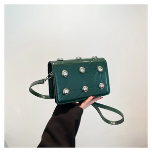 Retro dark green crossbody bag with quilted lattice pattern and silver metal studs