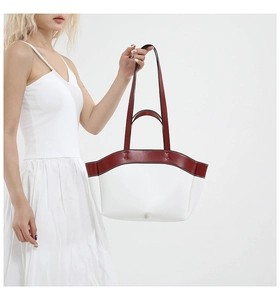 Detailed side view of large capacity burgundy and white two-tone tote bag with handle