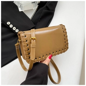 Chic dark camel square shoulder bag with woven edge detailing and adjustable gold strap