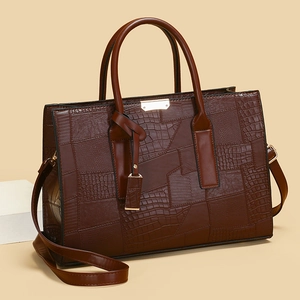 Brown crocodile pattern tote bag with snake skin texture and gold hardware details