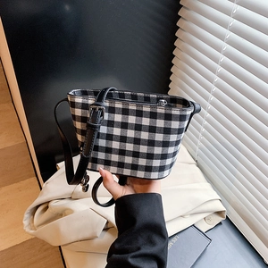 Checkered bucket bag in black and white vichy pattern with black leather strap