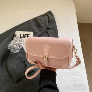 Pink lychee grain leather crossbody shoulder bag with gold buckle and adjustable strap