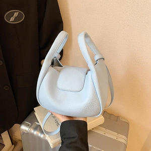 Light blue large capacity faux leather tote bag with unique wide handle and zip top