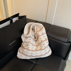 Woven cutout tote bag in beige with orange wave pattern for daily casual use