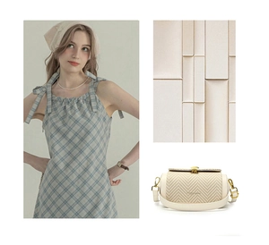 Detail of a beige woven box bag featuring a decorative gold shell clasp and stitch patterns
