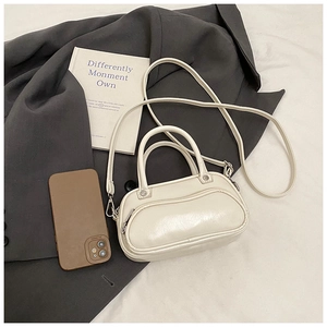 Chic white PU leather handbag with dual handles and detachable strap on elegant background