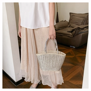 Minimalist straw woven tote bag in beige and silver with stylish metallic handles