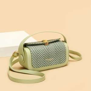 Chic mint green crossbody box bag with chevron woven flap and gold metallic lock closure