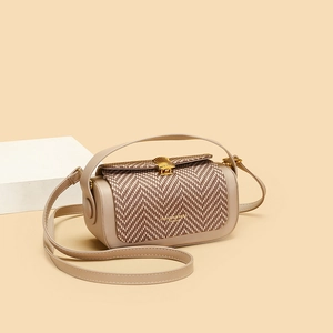 Quilted leather and herringbone fabric crossbody bag with elegant gold shell hardware