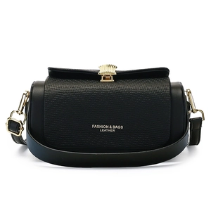 Chic black quilted leather crossbody box bag with gold hardware and shell-shaped clasp