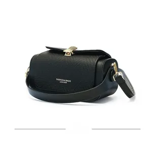 Side view of black lychee texture leather bag with gold buckle and embossed fashion text