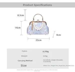 Detail of floral shell bag with pearl handle and metal chain showing 23x14x9cm dimensions