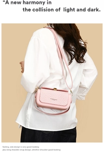 Detail of pink crossbody bag with houndstooth flap and gold-tone metal hardware