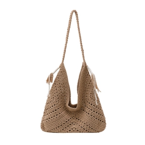 Retro woven khaki shoulder bag with crochet hollow patterns and fringe details