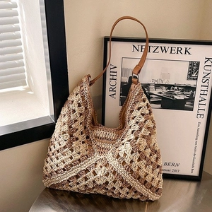 Handcrafted woven hobo bag with leather shoulder strap for casual summer vacations