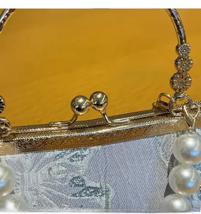 Detailed macro view of vintage light blue jacquard fabric and engraved gold metal frame