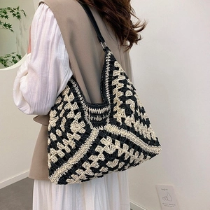 Contrast woven tote bag with geometric floral crochet pattern and black leather straps