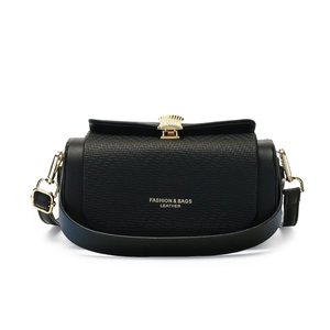 Fashionable black crossbody bag with woven texture and gold shell buckle closure