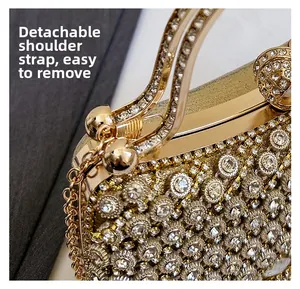 Macro detail of sparkling rhinestones and detachable gold metal chain on evening bag