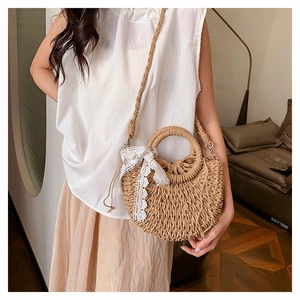 Semi-circular woven straw bag with white lace bow and round handles for women