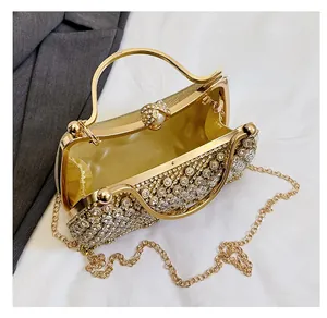 Interior view of gold rhinestone evening bag showing satin lining and pearl clasp detail