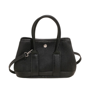 Chic black bucket bag with vertical pleats and round top handles on white background