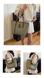 Detail of sage green tote bag with litchi texture and brown handles in home setting