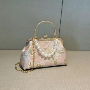 Pink brocade shell evening bag with floral patterns and pearl handle accessory