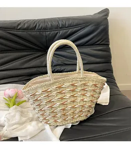 Detail of diamond weave pattern on straw tote bag with reinforced handles and soft lining
