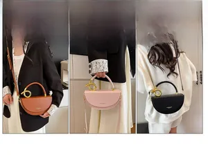 Three versatile ways to wear the saddle bag: crossbody, handheld, and shoulder style