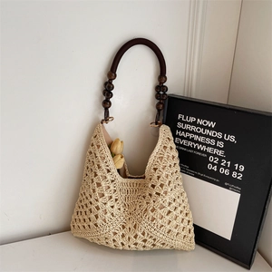 French style woven straw hobo beach bag with brown ring handle and wood beads