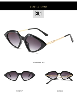 Detail view of small triangle frame sunglasses with purple gradient lenses and gold arms