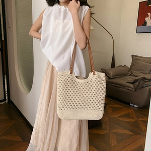 Hollow crochet knit tote bag with brown leather handles for summer fashion style
