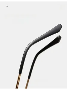 Detail of ergonomic curved metal temple arms for comfortable wear on trendy sunglasses