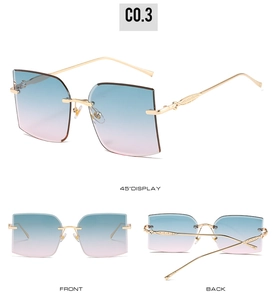 Detail of rimless square sunglasses featuring blue-pink gradient lenses and gold carved temples
