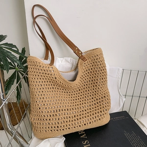 Fashionable beige woven hollow tote bag with brown PU handles for summer beach use