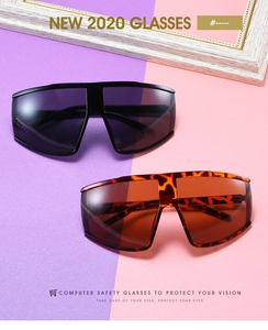 Detailed view of oversized windproof cycling sunglasses in black and tortoiseshell