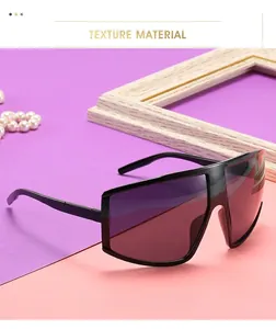 Close-up of black oversized cycling shield sunglasses with dark grey lenses in 45-degree view