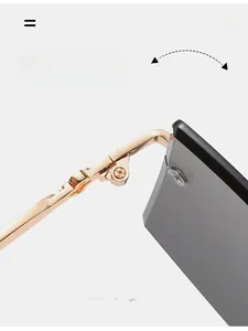 Macro shot of the durable golden metal hinge and sleek lens of rimless sunglasses