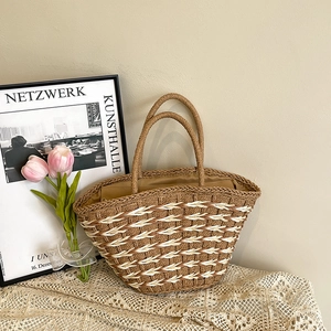 Summer woven straw tote bag with wave pattern and dual handles on a beige background
