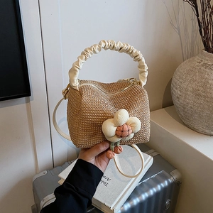 Straw beach handbag with ruffled handle and 3D cotton flower charm in natural tone
