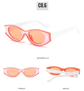 Detailansicht der Retro-Cat-Eye-Sonnenbrille mit orangen Gläsern und weißen Bügeln