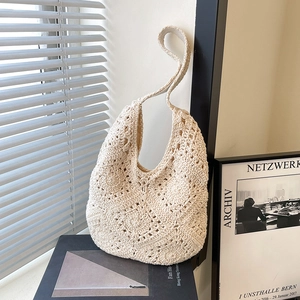 Chic beige woven hobo shoulder bag with intricate crochet pattern for summer
