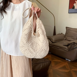 Cream handmade crochet hobo tote bag with hollow geometric patterns for summer fashion