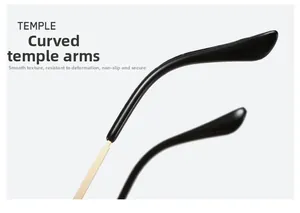Détail des branches noires courbées avec joints en métal doré sur lunettes rétro