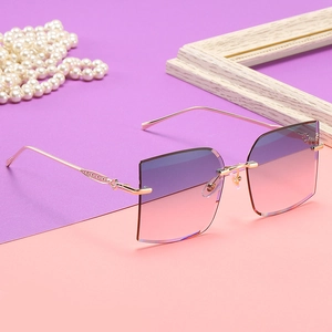 Frameless square sunglasses with pink-purple gradient lenses and gold hollow metal temples